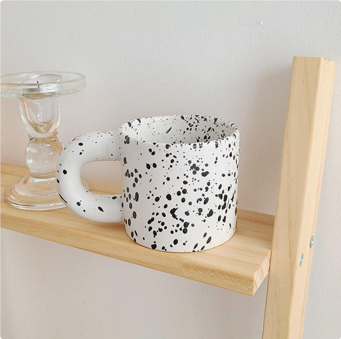 Tazza con inchiostro sparso