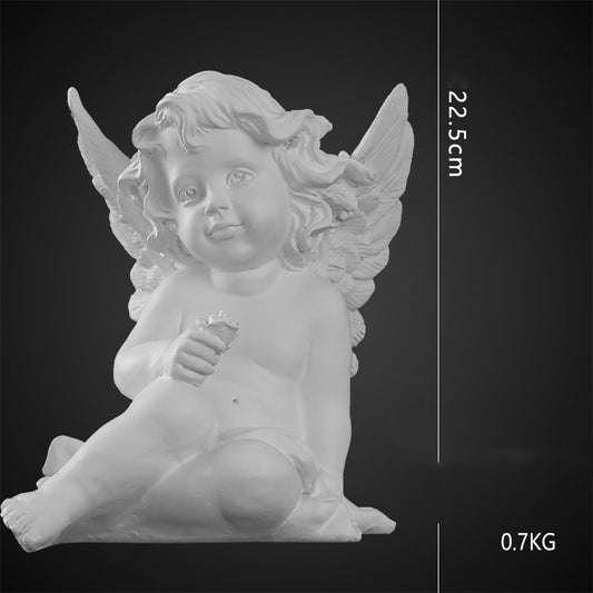 Cherubino seduto con fiore