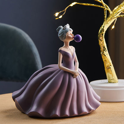 Statuina ragazza soffia bolle
