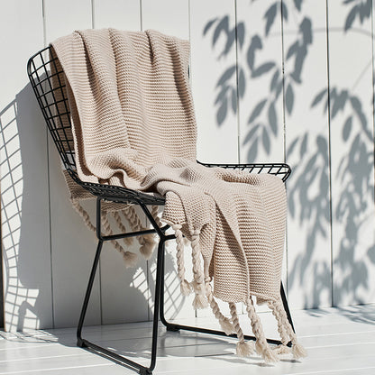 Coperta maglia con nappe
