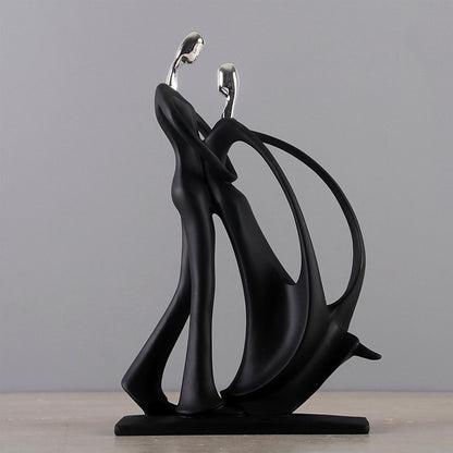 Scultura coppia nera argento abbracciate
