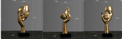 Sculture volti dorate emozioni tre