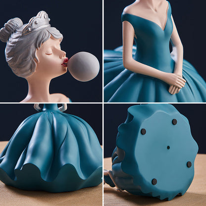 Statuina ragazza soffia bolle