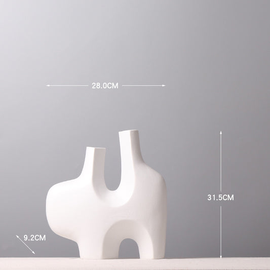 Vaso bianco con aperture geometriche