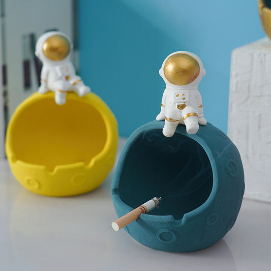 Posacenere sferico turchese con astronauta bianco