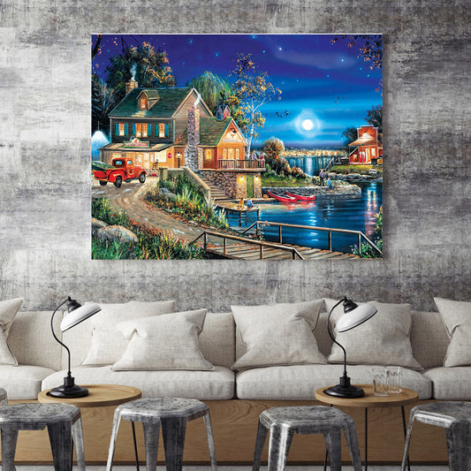 Quadro su tela Casetta illuminata al tramonto con luna