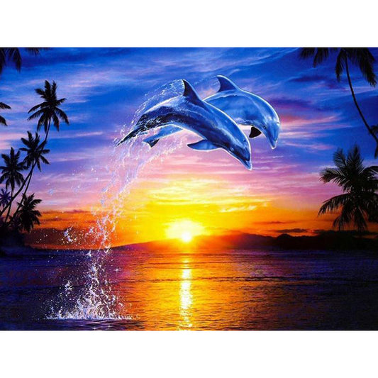 Quadro su tela Delfini che saltano al tramonto