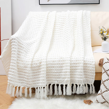 Coperta in lana con nappine