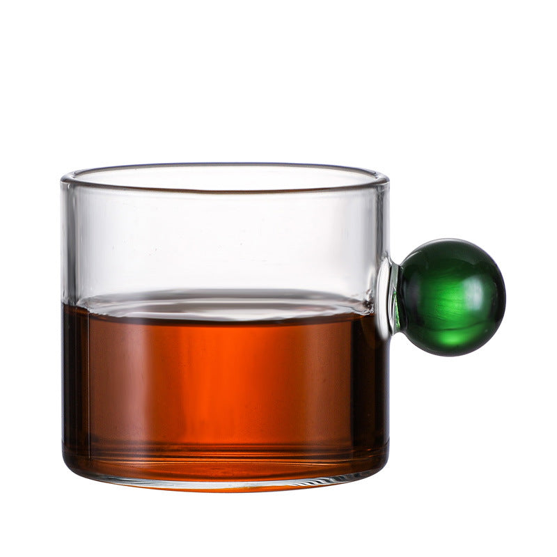Tazza in vetro con manico sferico