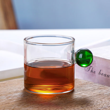 Tazza in vetro con manico sferico