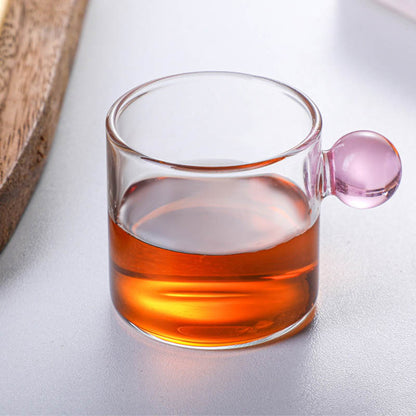Tazza in vetro con manico sferico
