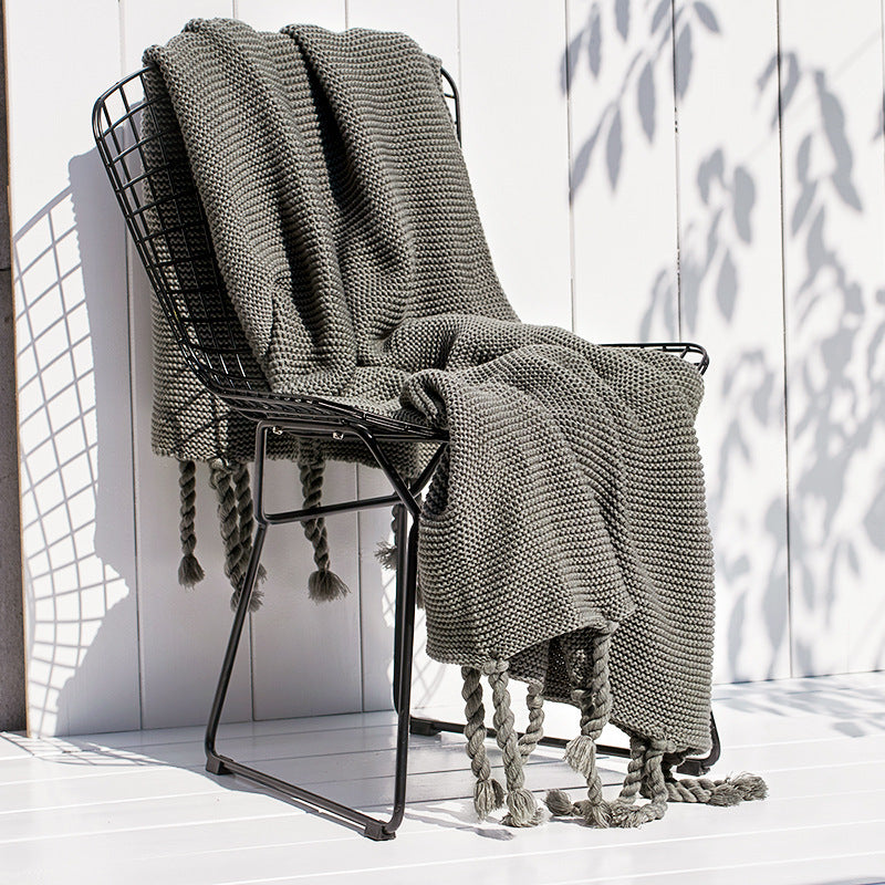 Coperta maglia con nappe