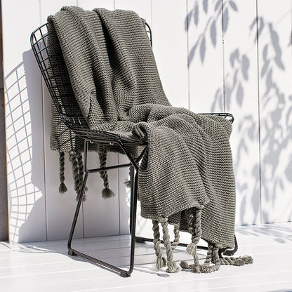 Coperta maglia con nappe