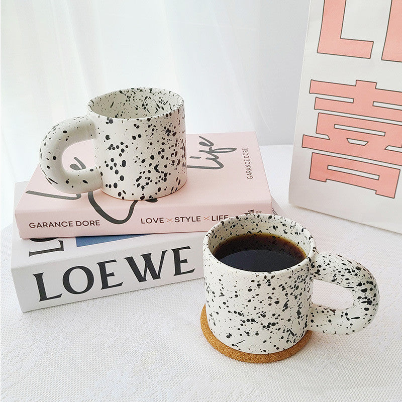 Tazza con inchiostro sparso
