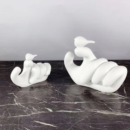 Scultura mano uccello