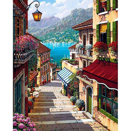 Quadro su tela Strada verso il lago tra montagne