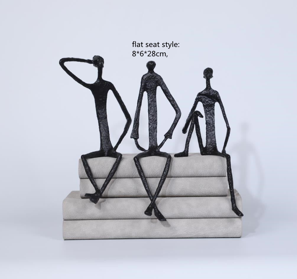 Scultura ferro uomo seduto