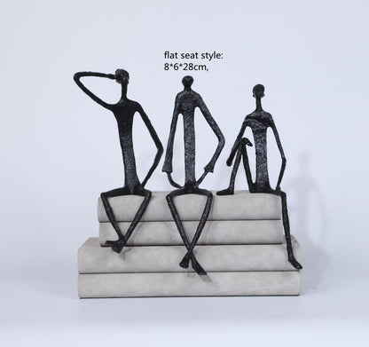 Scultura ferro uomo seduto