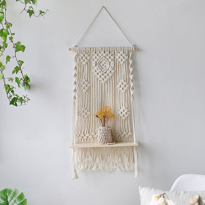 Arazzo tessuto con nappe