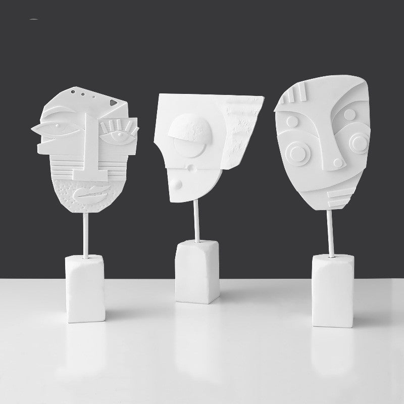 Scultura volto e fiore