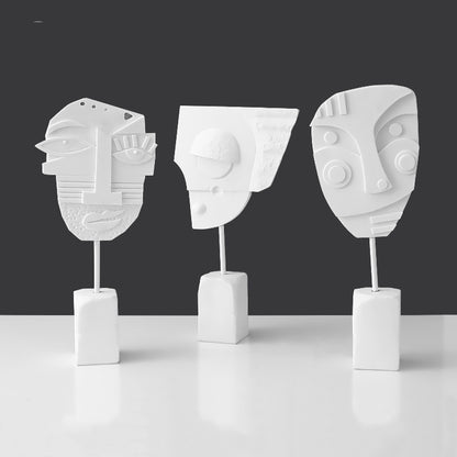 Scultura volto e fiore