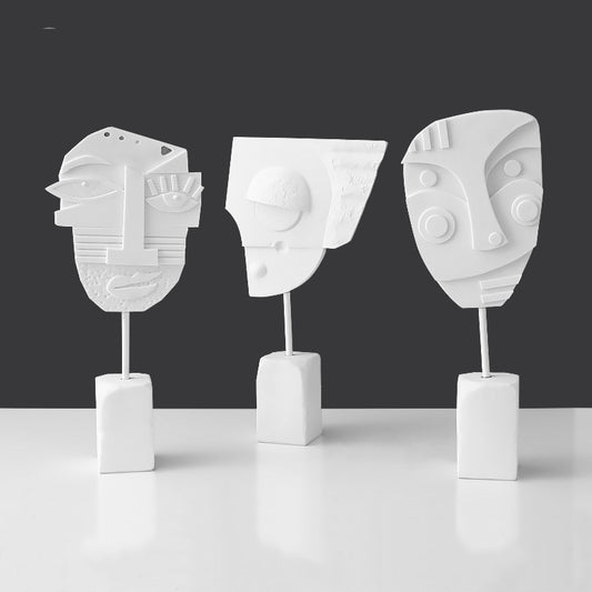 Scultura volto e fiore
