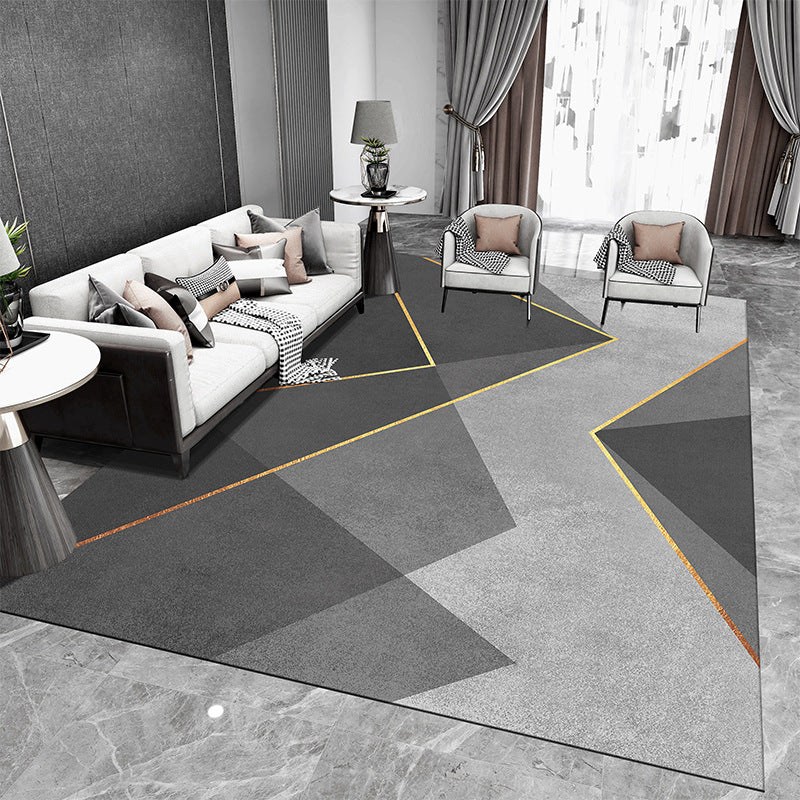 Tappeto geometrico grigio e nero con