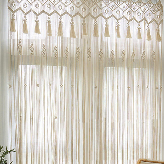 Arazzo Macramé con nappini e geometrie