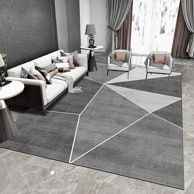 Tappeto geometrico grigio e nero con