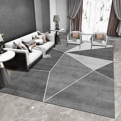 Tappeto geometrico grigio e nero con
