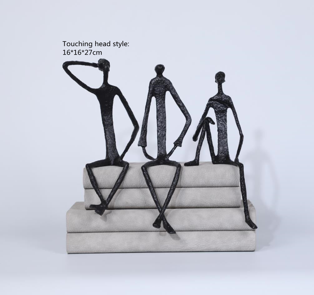 Scultura ferro uomo seduto