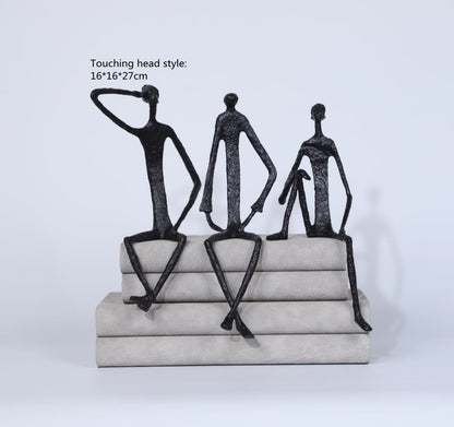 Scultura ferro uomo seduto