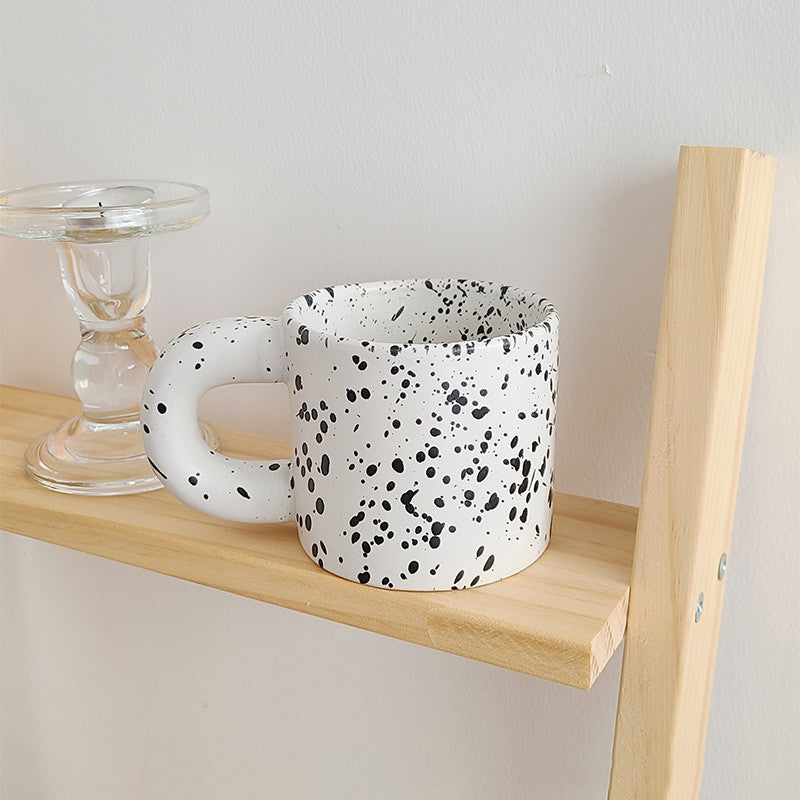 Tazza con inchiostro sparso