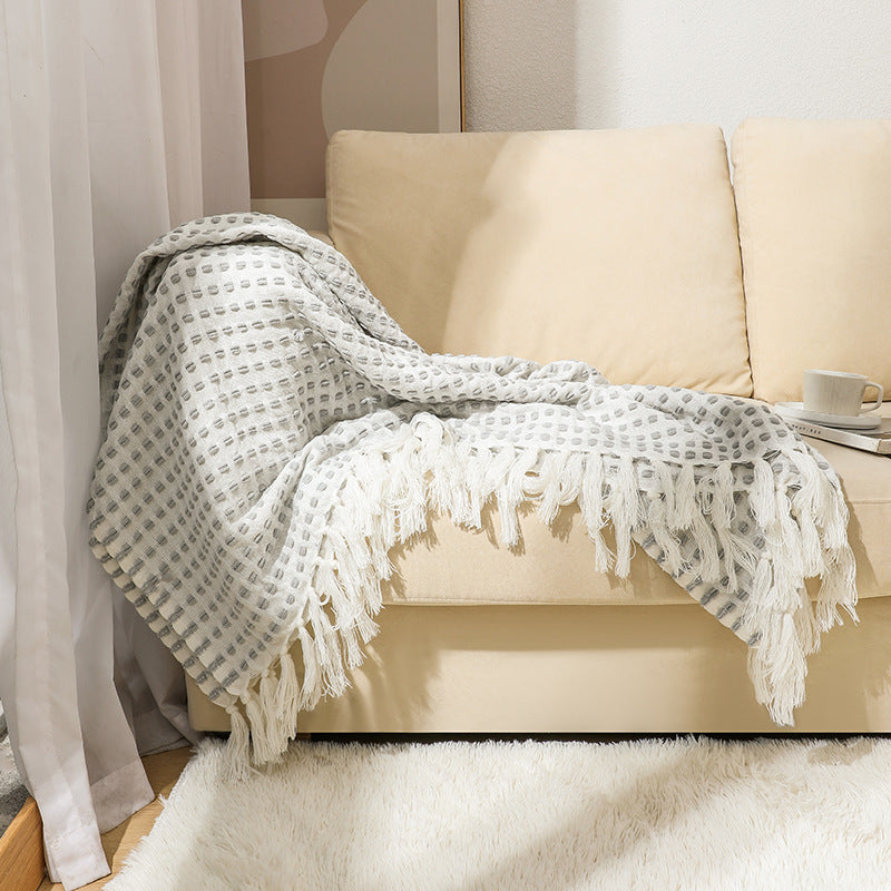 Coperta in lana con nappine