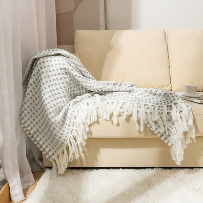 Coperta in lana con nappine