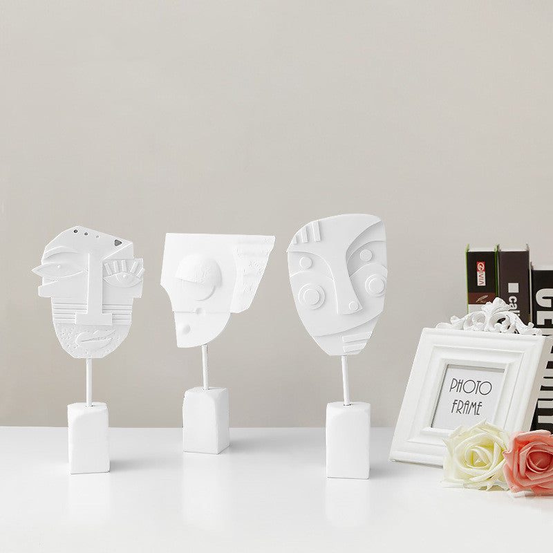 Scultura volto e fiore