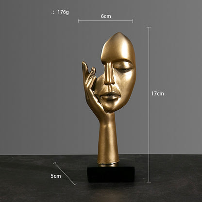 Sculture volti dorate emozioni tre