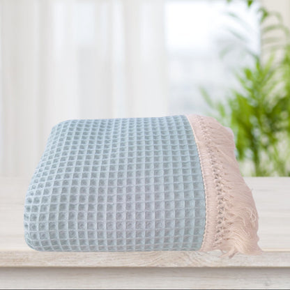 Coperta con nappine