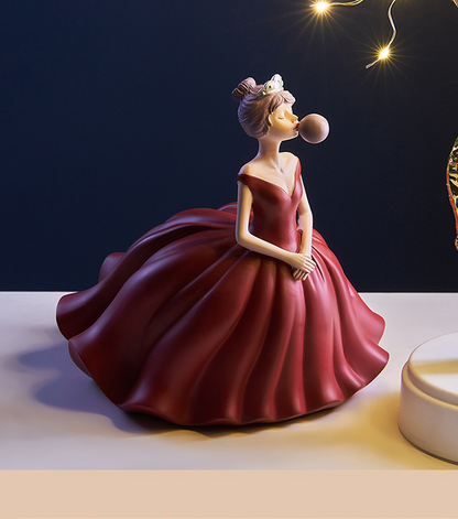 Statuina ragazza soffia bolle