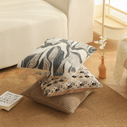 Copricuscino beige con motivo floreale