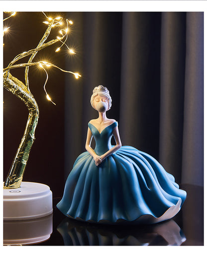 Statuina ragazza soffia bolle