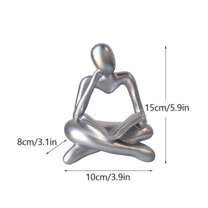 Statuetta lettura resina