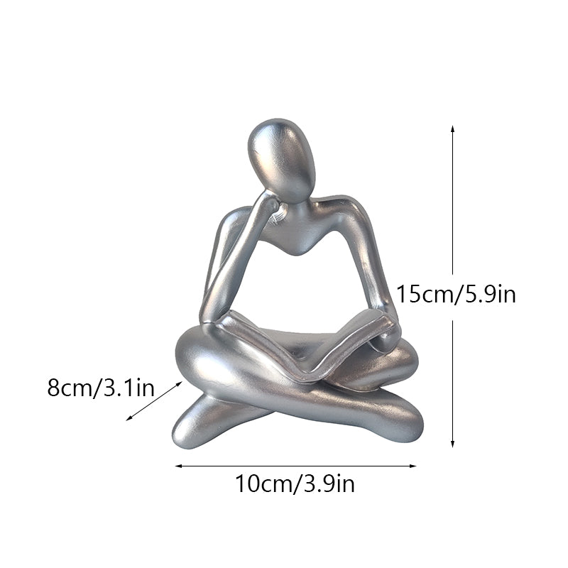 Statuetta lettura resina