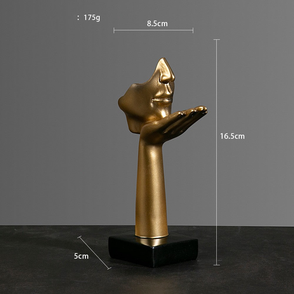 Sculture volti dorate emozioni tre