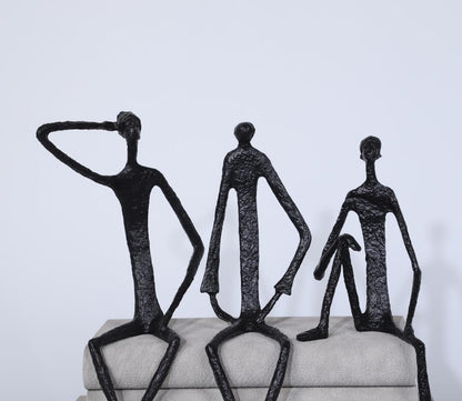 Scultura ferro uomo seduto