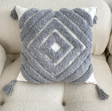 Cuscino boho con nappine