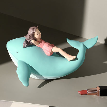 Balene azzurre con bambine sedute