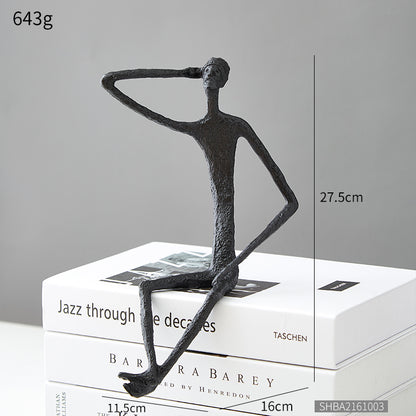 Scultura ferro uomo seduto