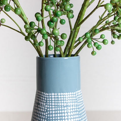 Vaso alto verde con rete bianca
