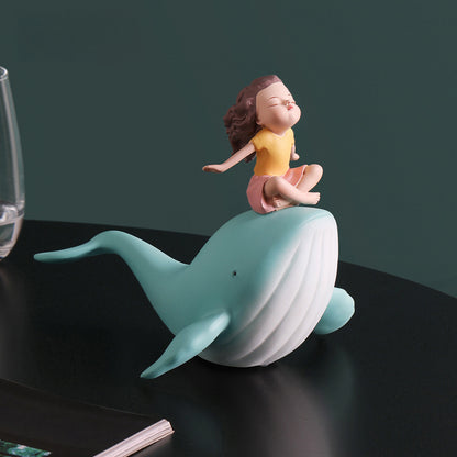 Balene azzurre con bambine sedute